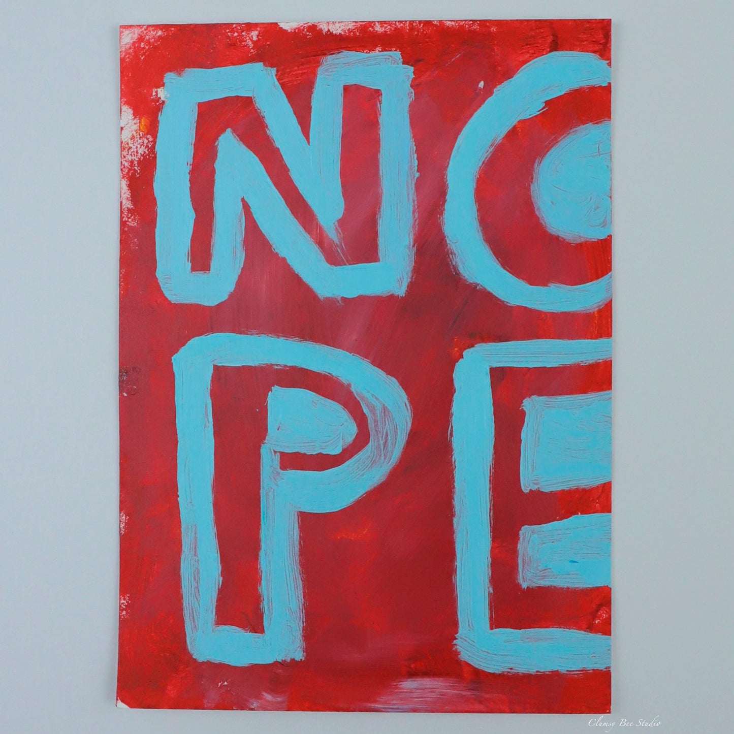 "Umm...Nope" is a red painting with blue text reading nope